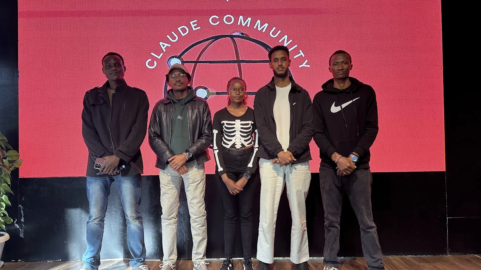 Five people standing in front of the Claude Community screen at the Fable 5.1 Build Day in Nairobi.